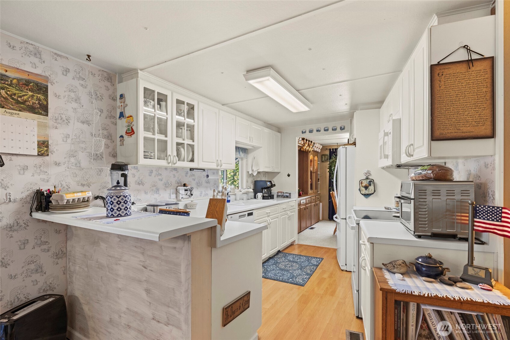 3167 Hunt Road Oak Harbor, WA 98277 - Photo 5 of 40 a kitchen with stainless steel appliances kitchen island granite countertop a sink stove and cabinets