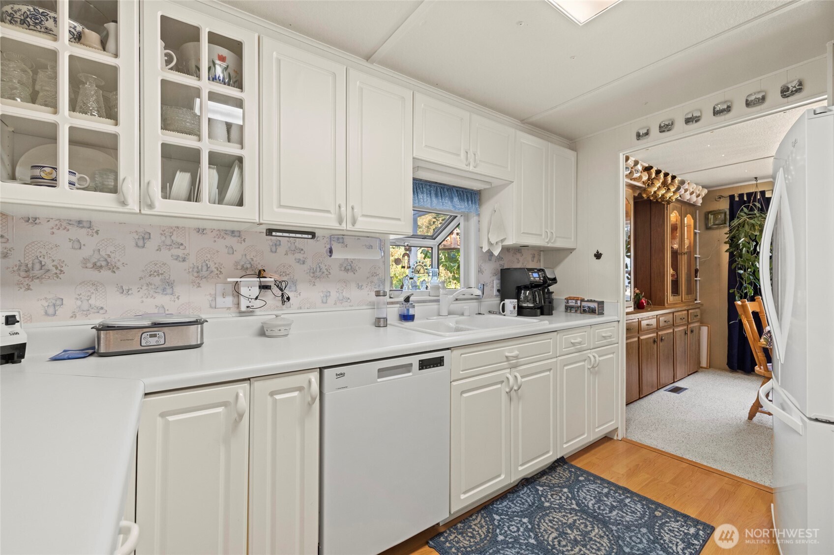 3167 Hunt Road Oak Harbor, WA 98277 - Photo 7 of 40 a kitchen with stainless steel appliances granite countertop a sink a stove and a refrigerator