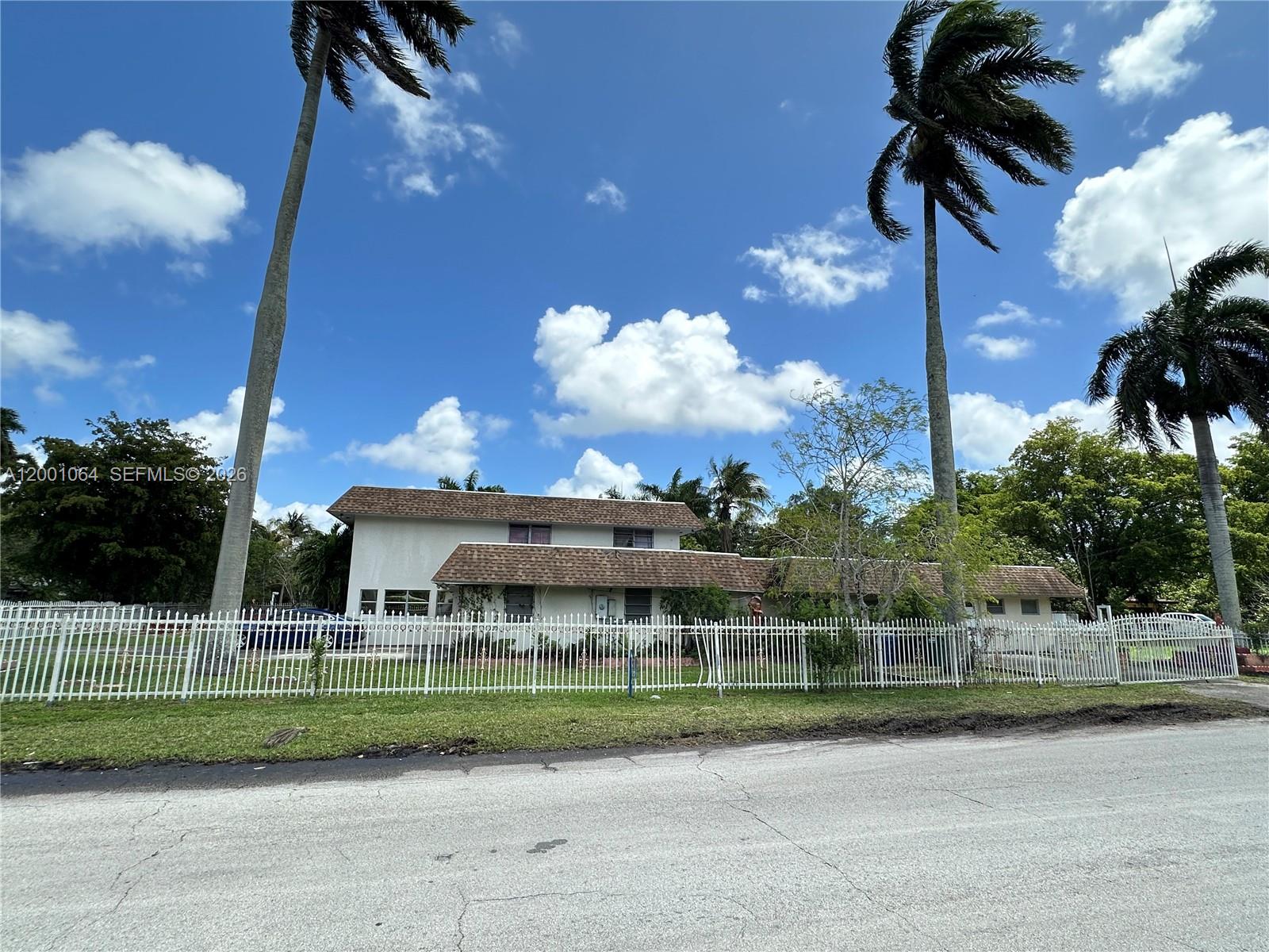 200 Northeast 158th Street Miami, FL 33162 - Photo 5 of 16 a view of a house and a yard