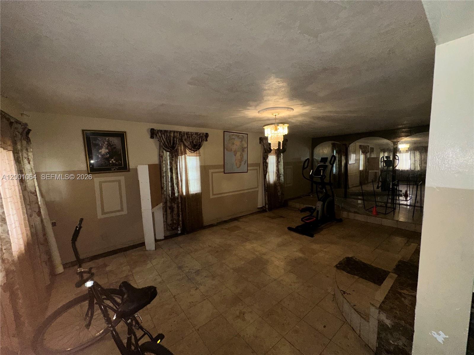 200 Northeast 158th Street Miami, FL 33162 - Photo 9 of 16 a view of a room with gym equipment