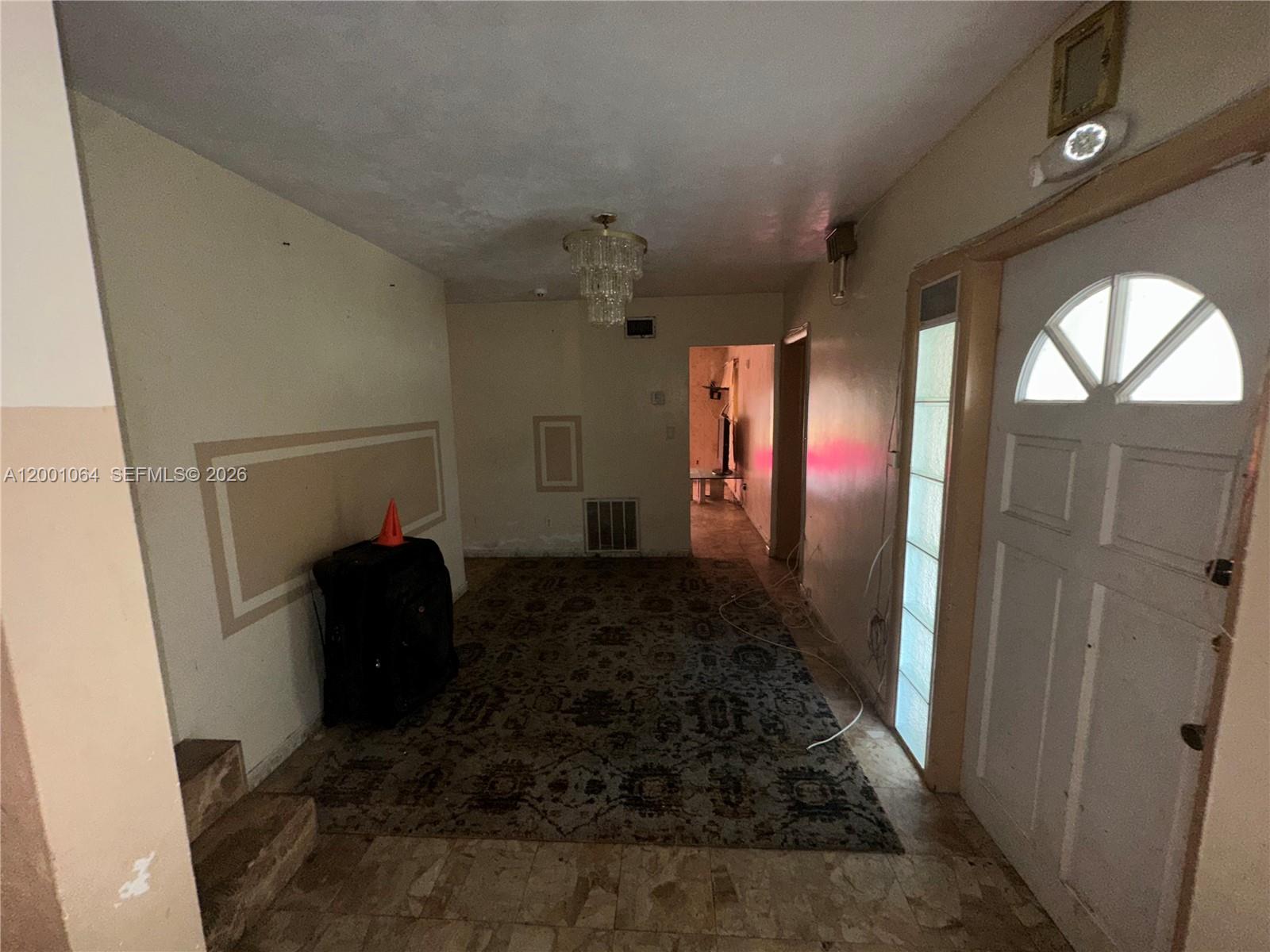 200 Northeast 158th Street Miami, FL 33162 - Photo 10 of 16 a room with window and stairs