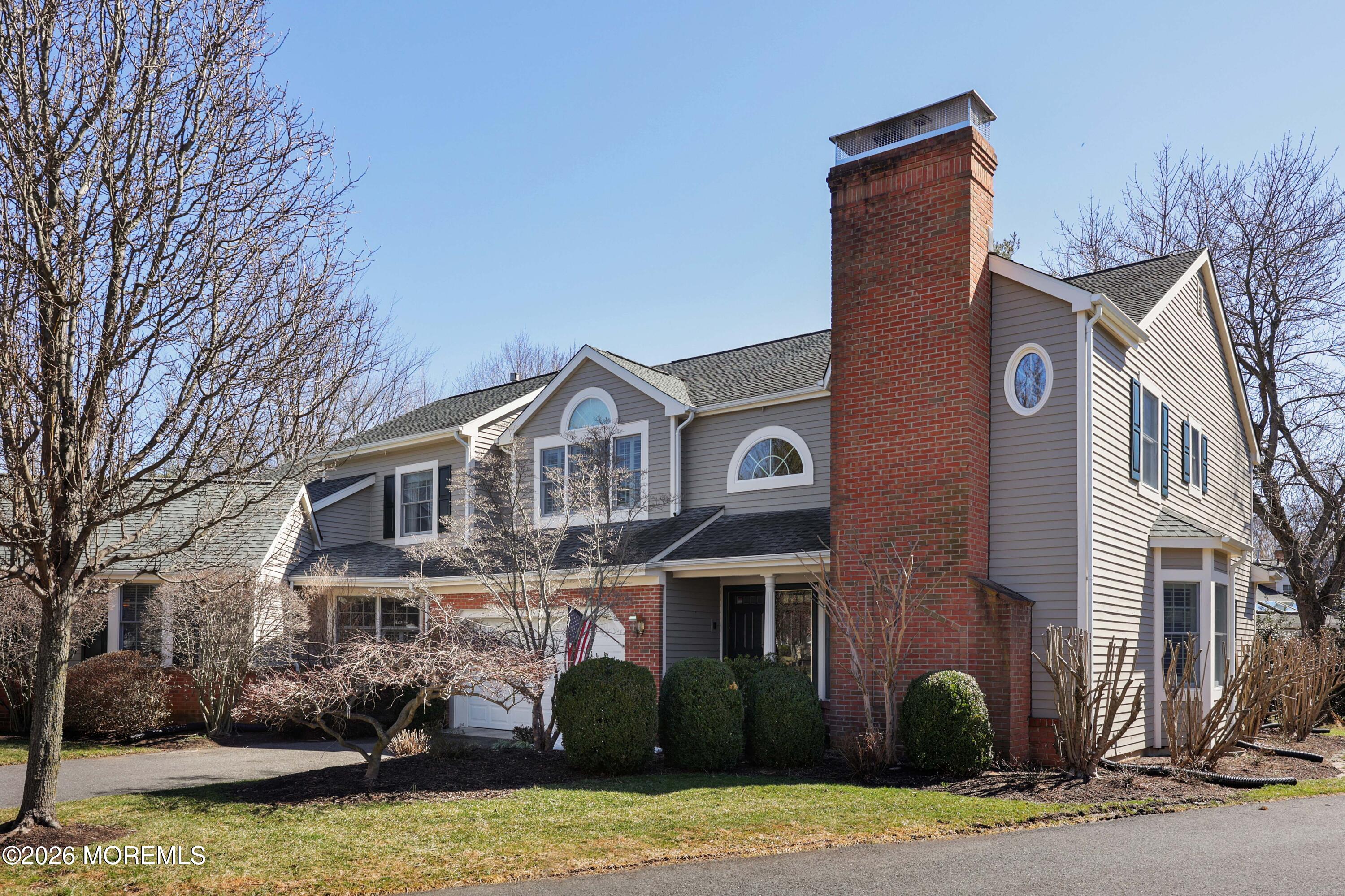 13 Country Lane Little Silver, NJ 07739 - Photo 1 of 42 a front view of a house with garden and trees