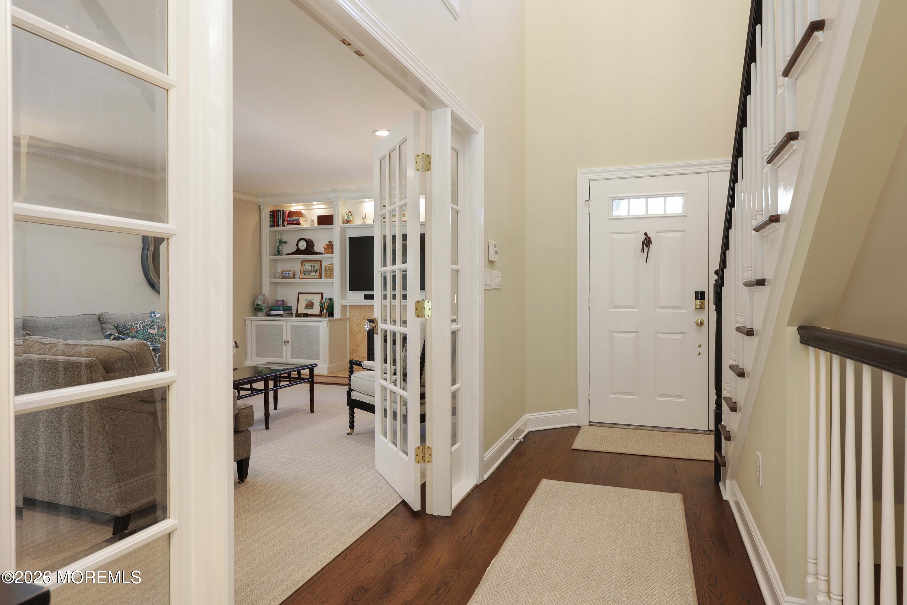 13 Country Lane Little Silver, NJ 07739 - Photo 18 of 42 a view of a hallway with wooden floor and dining room