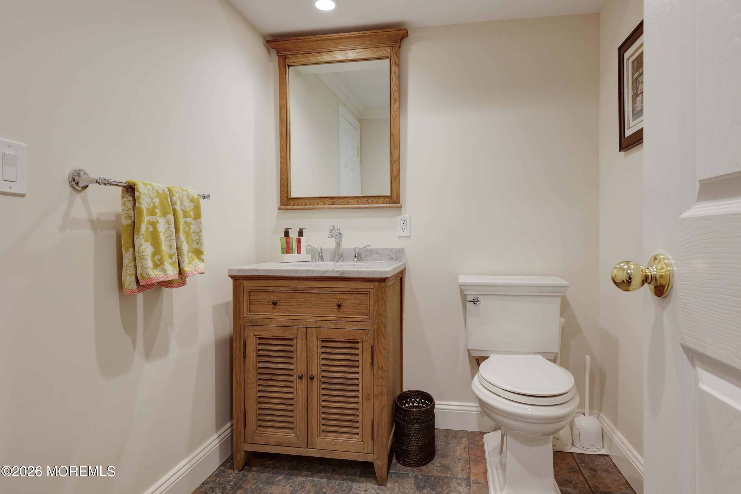13 Country Lane Little Silver, NJ 07739 - Photo 34 of 42 a bathroom with a toilet sink and mirror