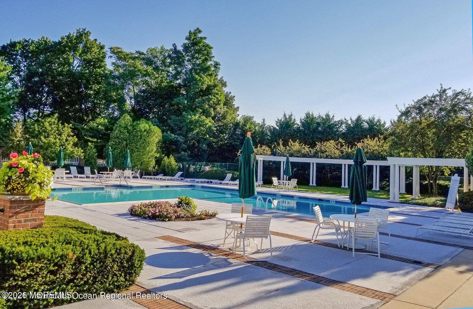 13 Country Lane Little Silver, NJ 07739 - Photo 39 of 42 a view of a house with backyard swimming pool and sitting area