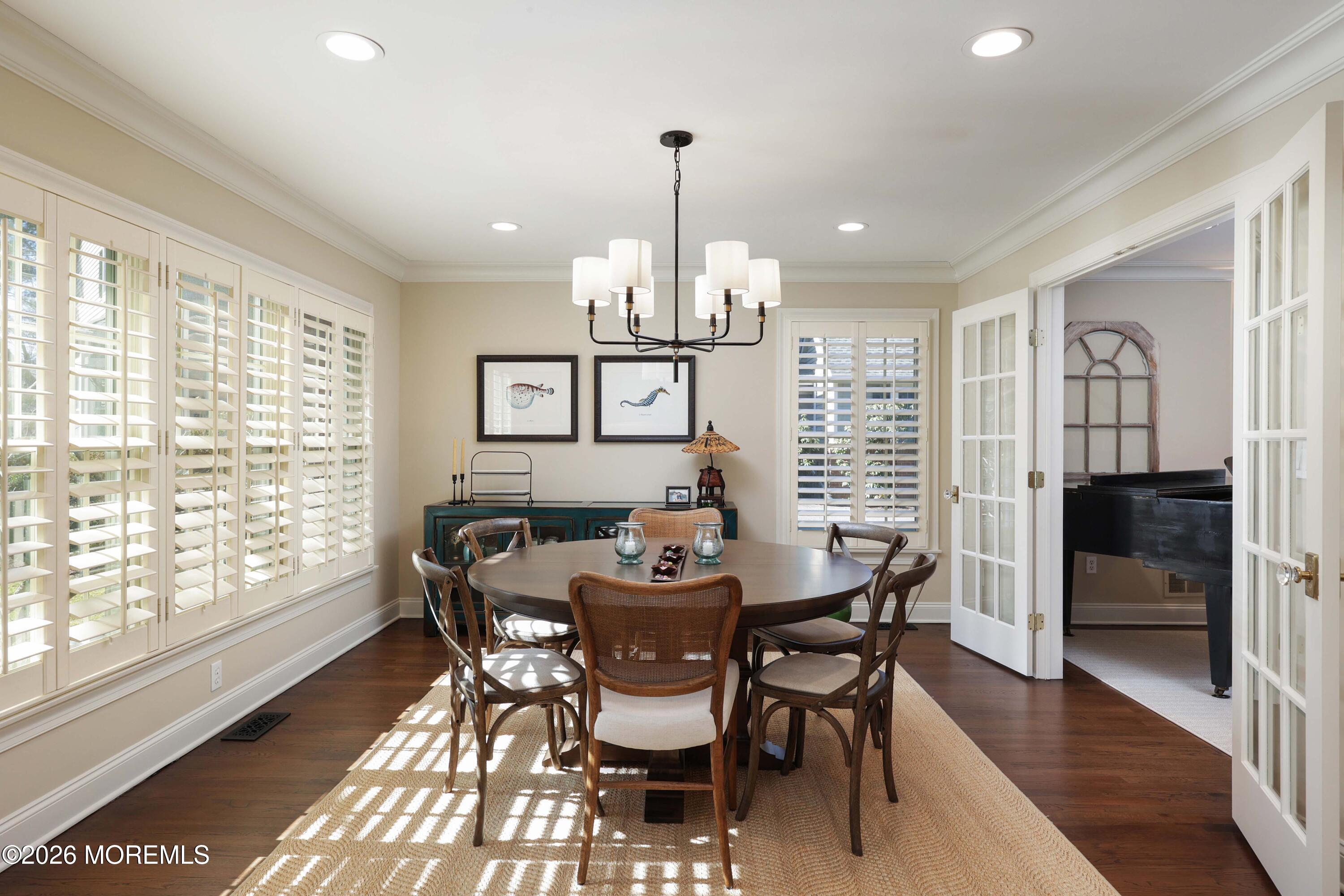 13 Country Lane Little Silver, NJ 07739 - Photo 6 of 42 a dining room with furniture a chandelier and wooden floor