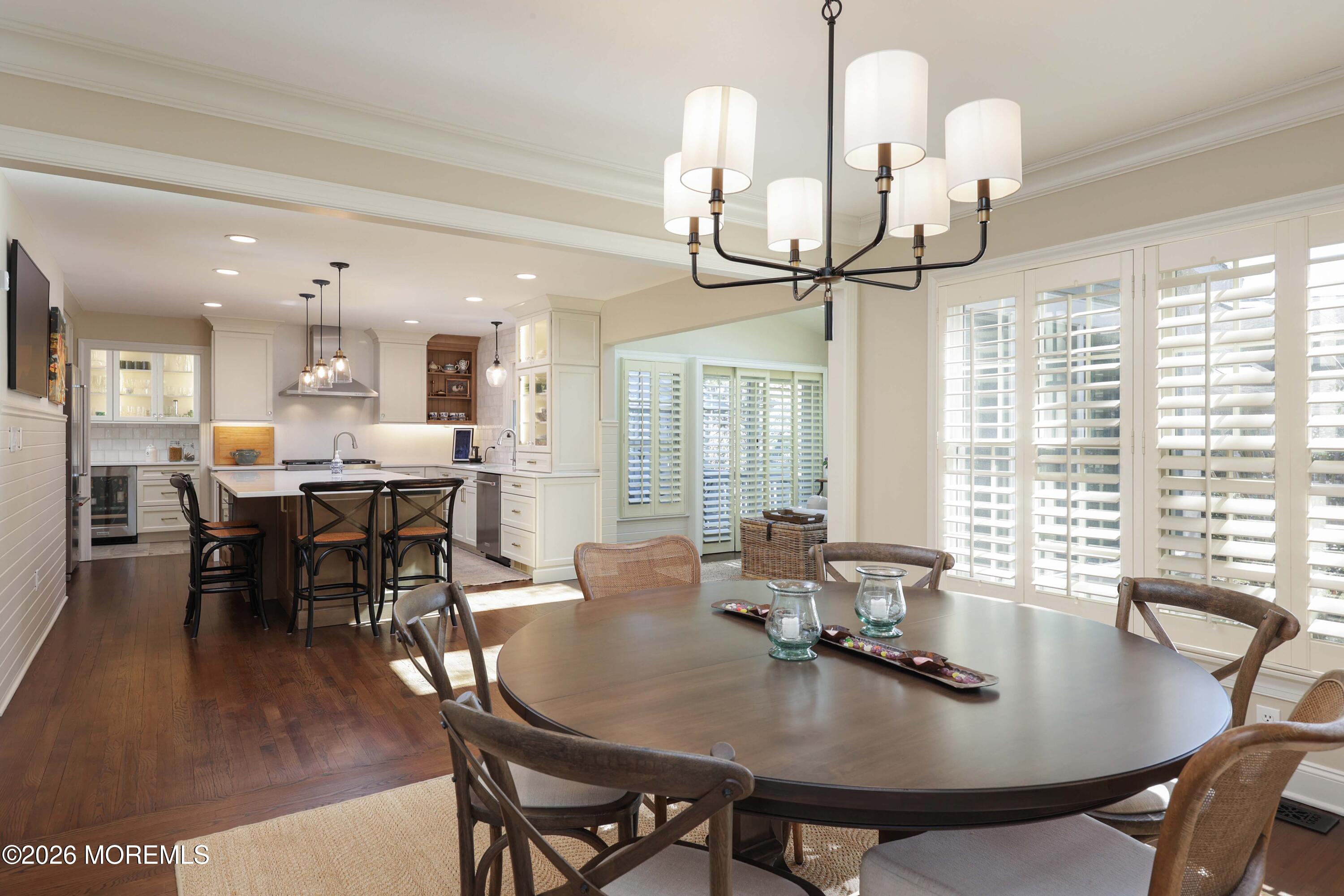 13 Country Lane Little Silver, NJ 07739 - Photo 7 of 42 a dining room with wooden floor a chandelier a wooden table and chairs