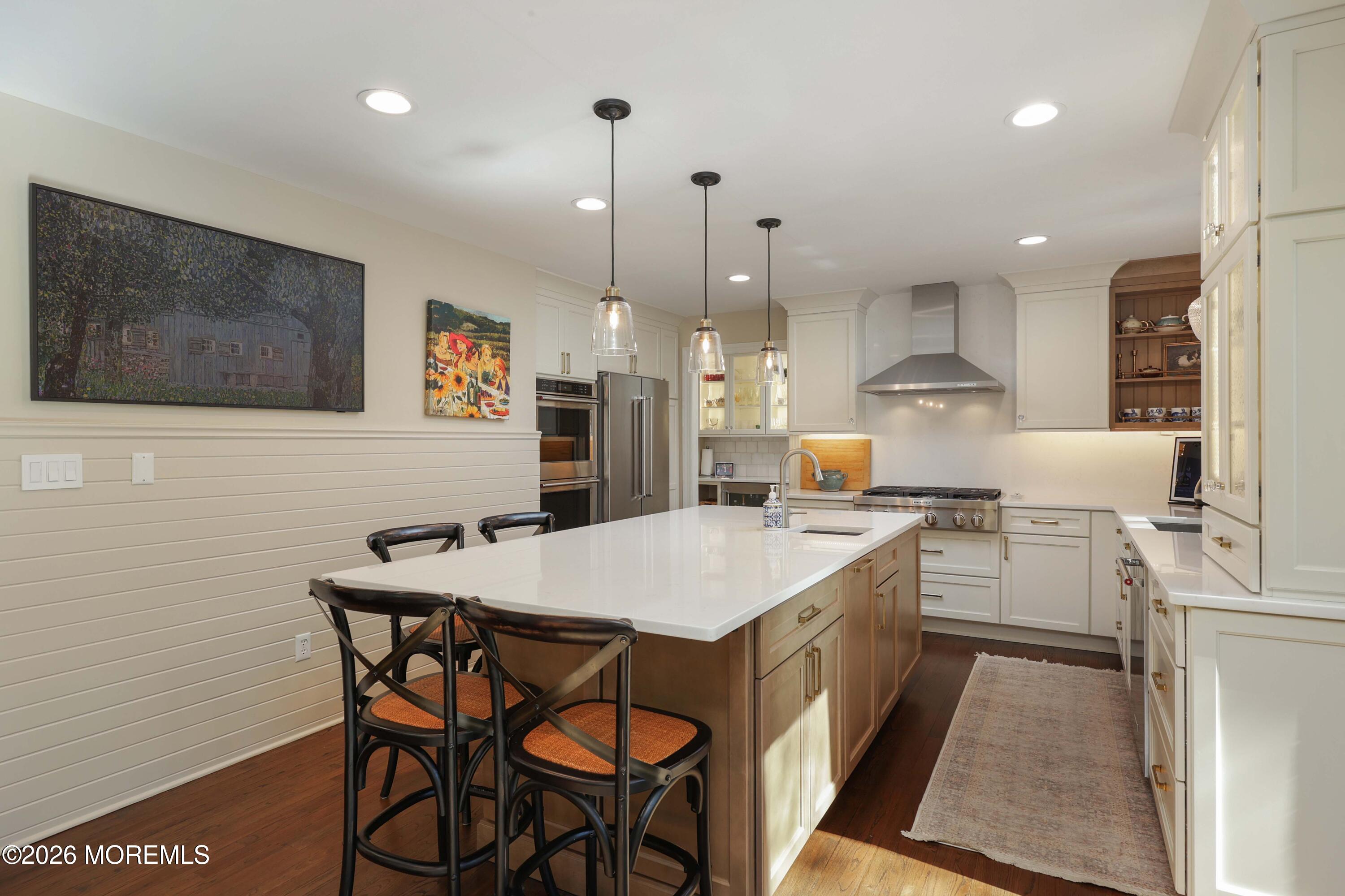 13 Country Lane Little Silver, NJ 07739 - Photo 8 of 42 a kitchen with a table chairs sink and cabinets