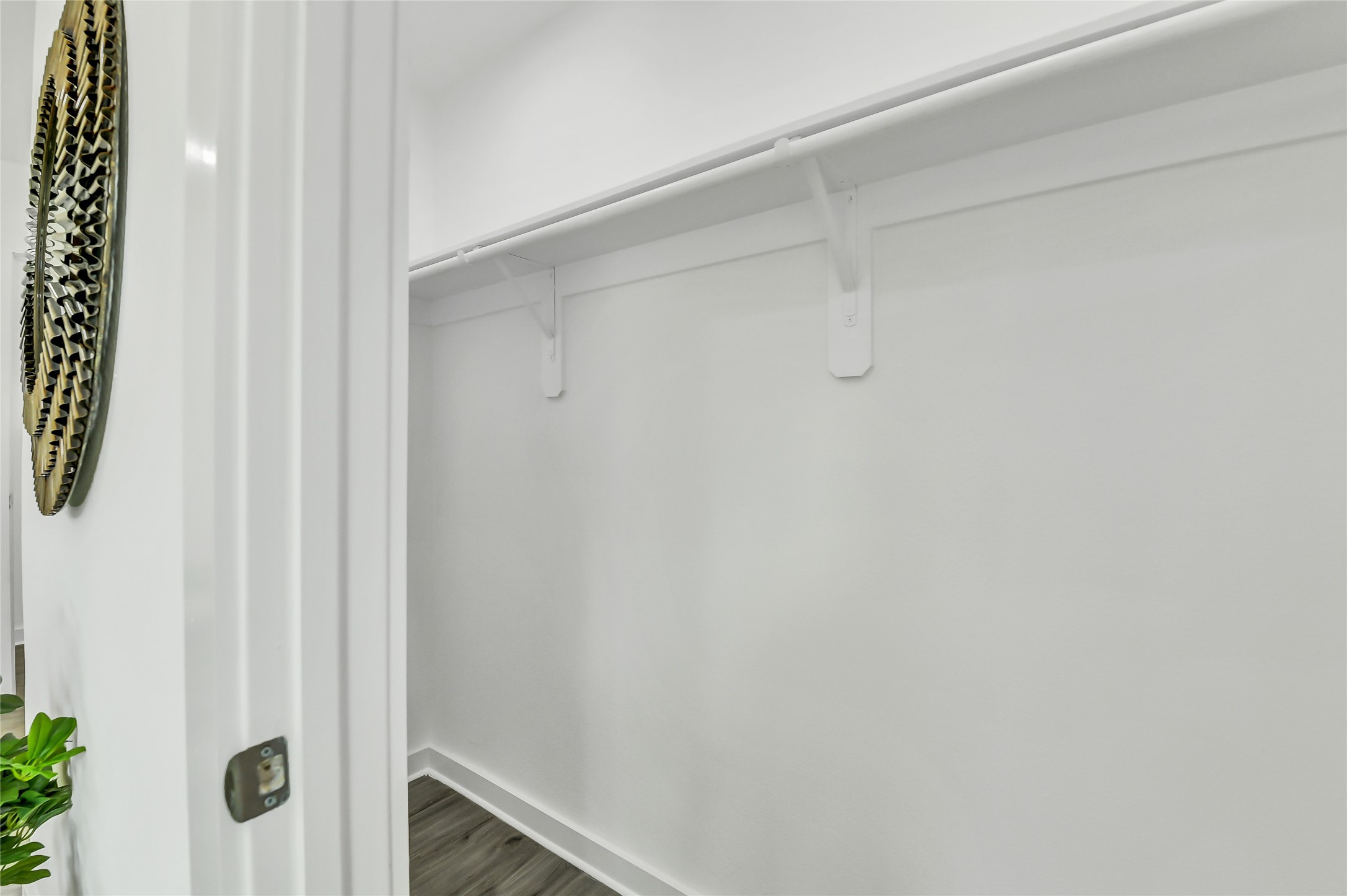 110 Harris Court Houston, TX 77009 - Photo 19 of 31 A generous walk-in closet offering plenty of built-in shelving and hanging space for organized storage.