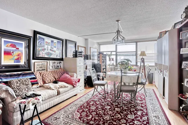 a dining room with lots of furniture and a book shelf