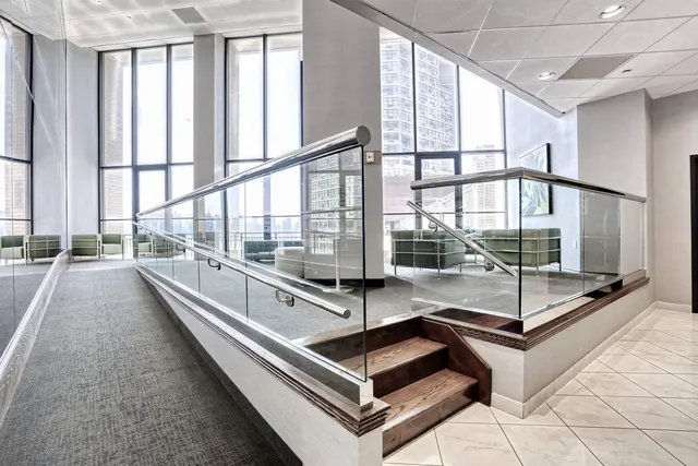 a kitchen with stainless steel appliances kitchen island granite countertop a stove and a sink