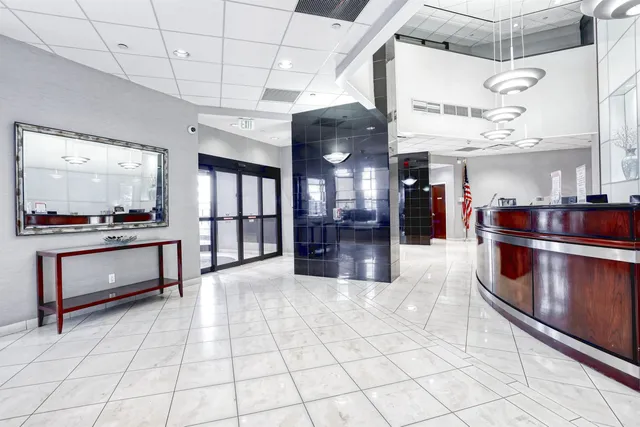 a view of a room with lots of stuff and hardwood floor