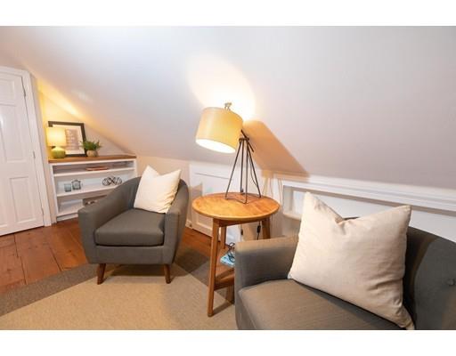 107 Groton School Road Ayer, MA 01432 - Photo 17 of 25 a living room with a couch and a table