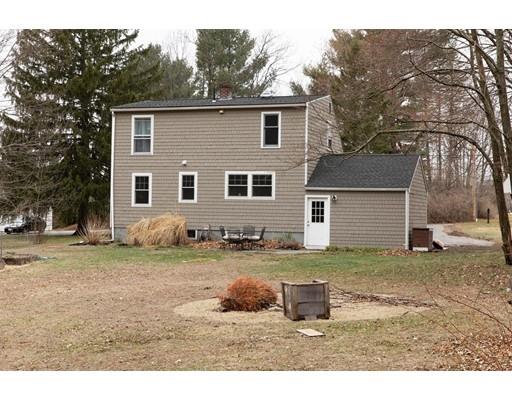 107 Groton School Road Ayer, MA 01432 - Photo 24 of 25 a backyard of a house with table and chairs