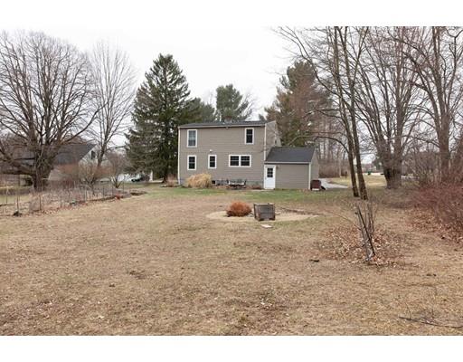 107 Groton School Road Ayer, MA 01432 - Photo 25 of 25 a view of a dirt road with a building in the background