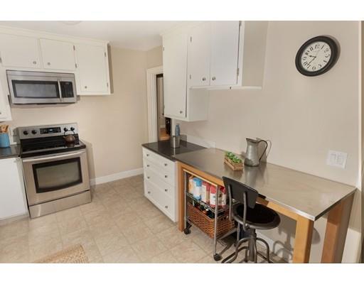 107 Groton School Road Ayer, MA 01432 - Photo 8 of 25 a kitchen with stainless steel appliances a stove a sink and a refrigerator