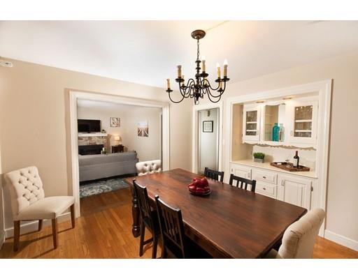 107 Groton School Road Ayer, MA 01432 - Photo 9 of 25 a view of a dining room and livingroom with furniture wooden floor a chandelier