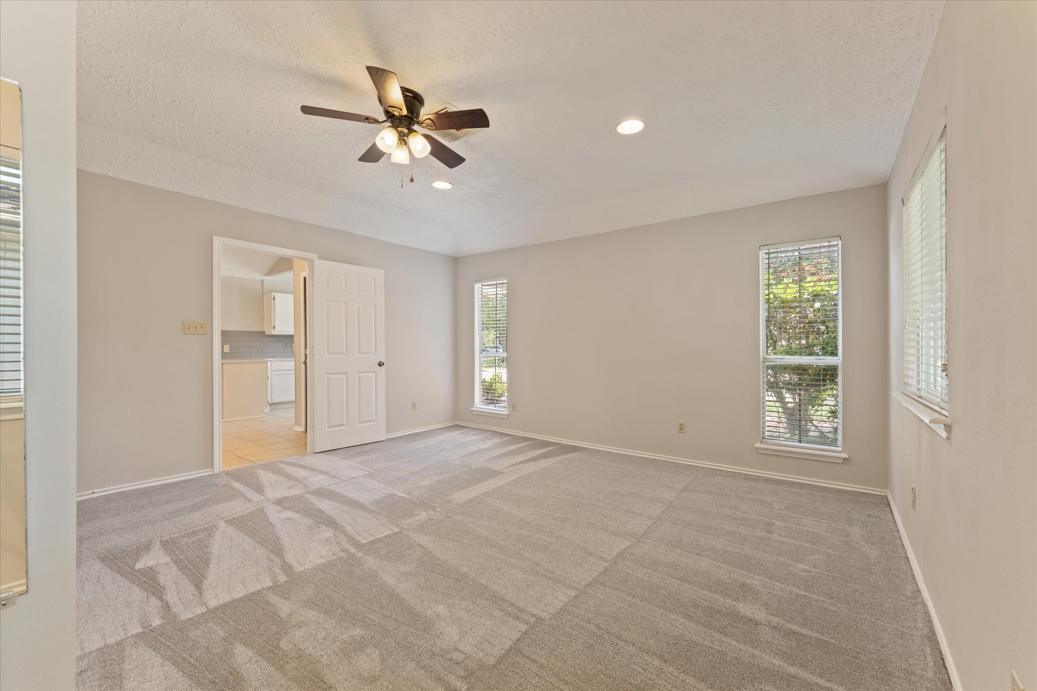 4906 Meadowfox Place Spring, TX 77389 - Photo 22 of 39 Primary bedroom with ensuite bathroom overlooking the kitchen