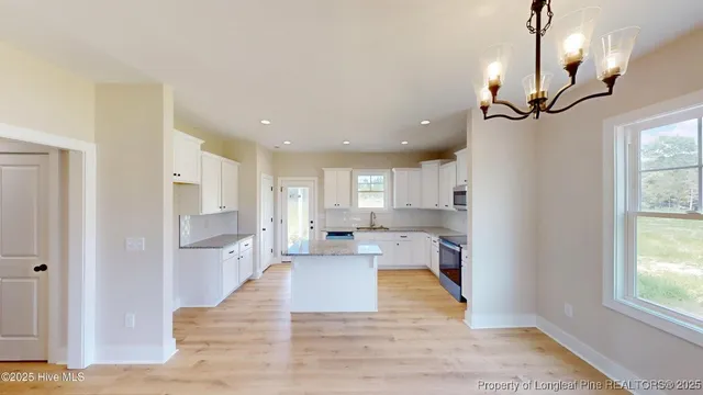 a view of a kitchen with microwave and cabinets