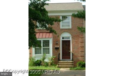 6474 Franconia Road Springfield, VA 22150 - Photo 1 of 1 a view of a house with a small window and potted plants