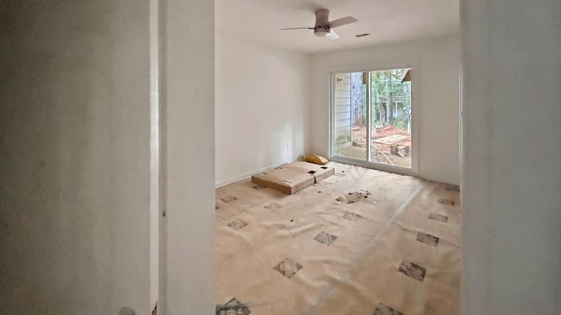 35 Fox Trail Westminster, SC 29693 - Photo 7 of 10 Large sliding glass doors open directly to the outdoor spaces from this versatile room.