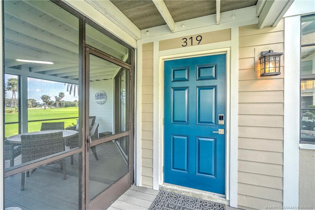 319 Golfview Circle, Unit 319 Stuart, FL 34996 - Photo 19 of 56 a view of a wooden door