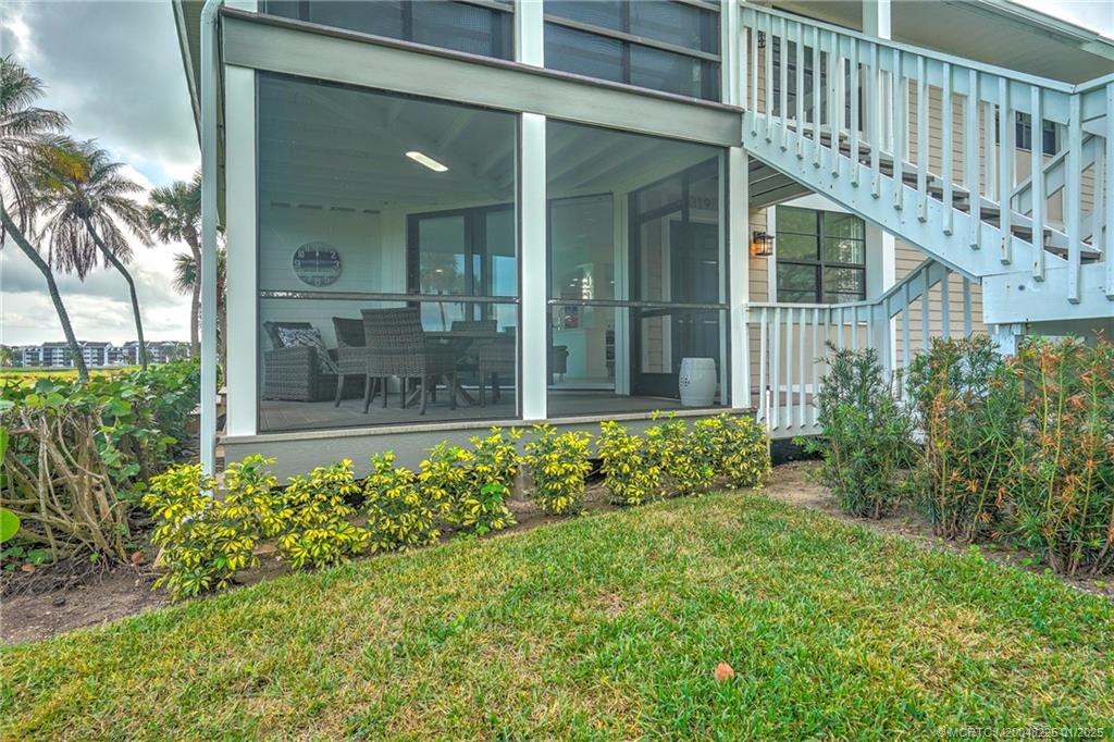 319 Golfview Circle, Unit 319 Stuart, FL 34996 - Photo 23 of 56 a view of a garden with a fountain