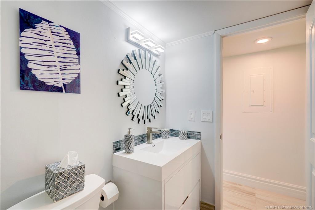 319 Golfview Circle, Unit 319 Stuart, FL 34996 - Photo 37 of 56 a bathroom with a sink and a mirror