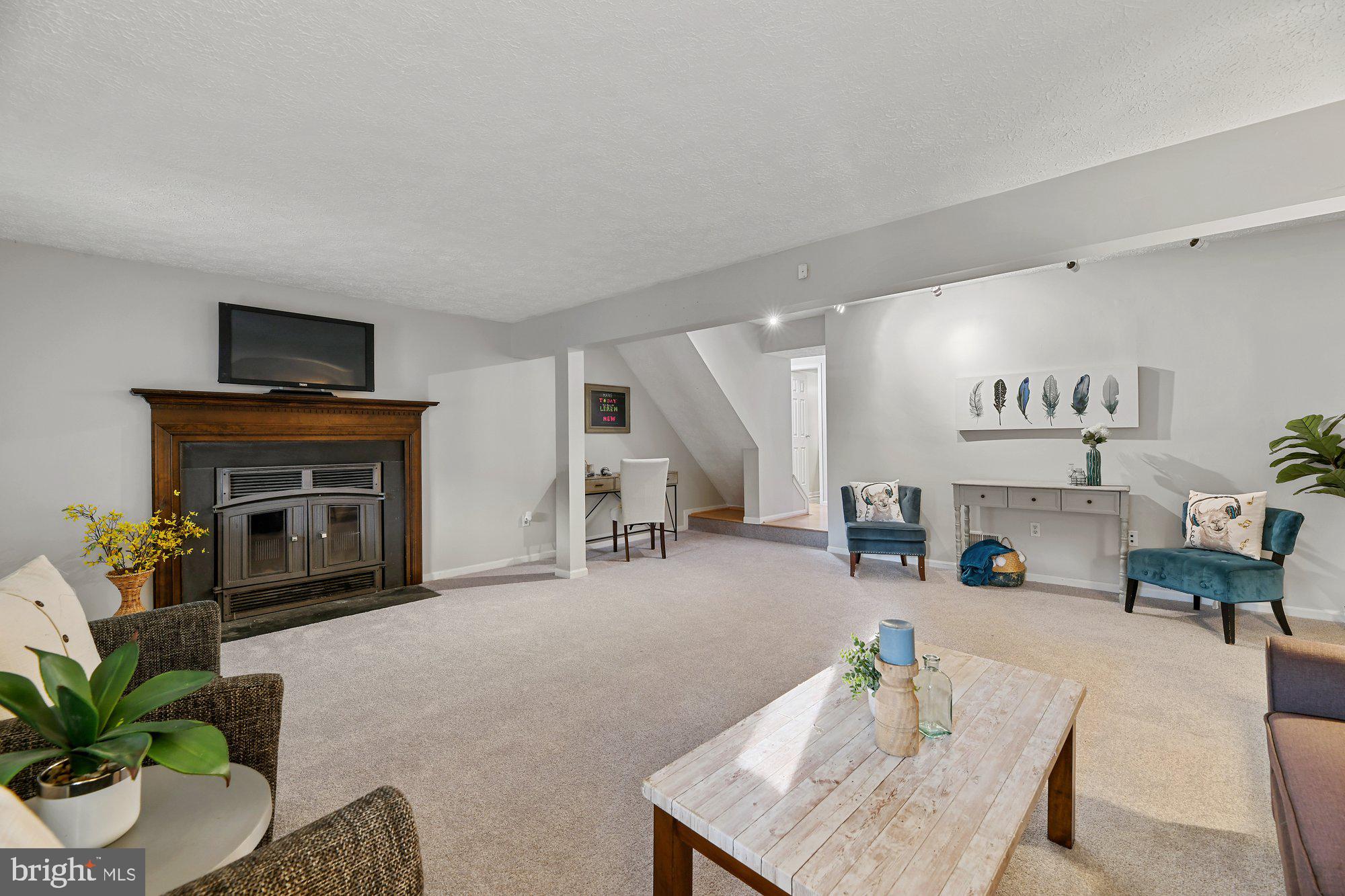 21 Hyacinth Road Baltimore, MD 21234 - Photo 27 of 41 Lower level family room w/wood burning fireplace