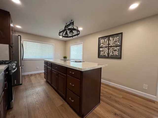 a kitchen with a counter space a sink and appliances