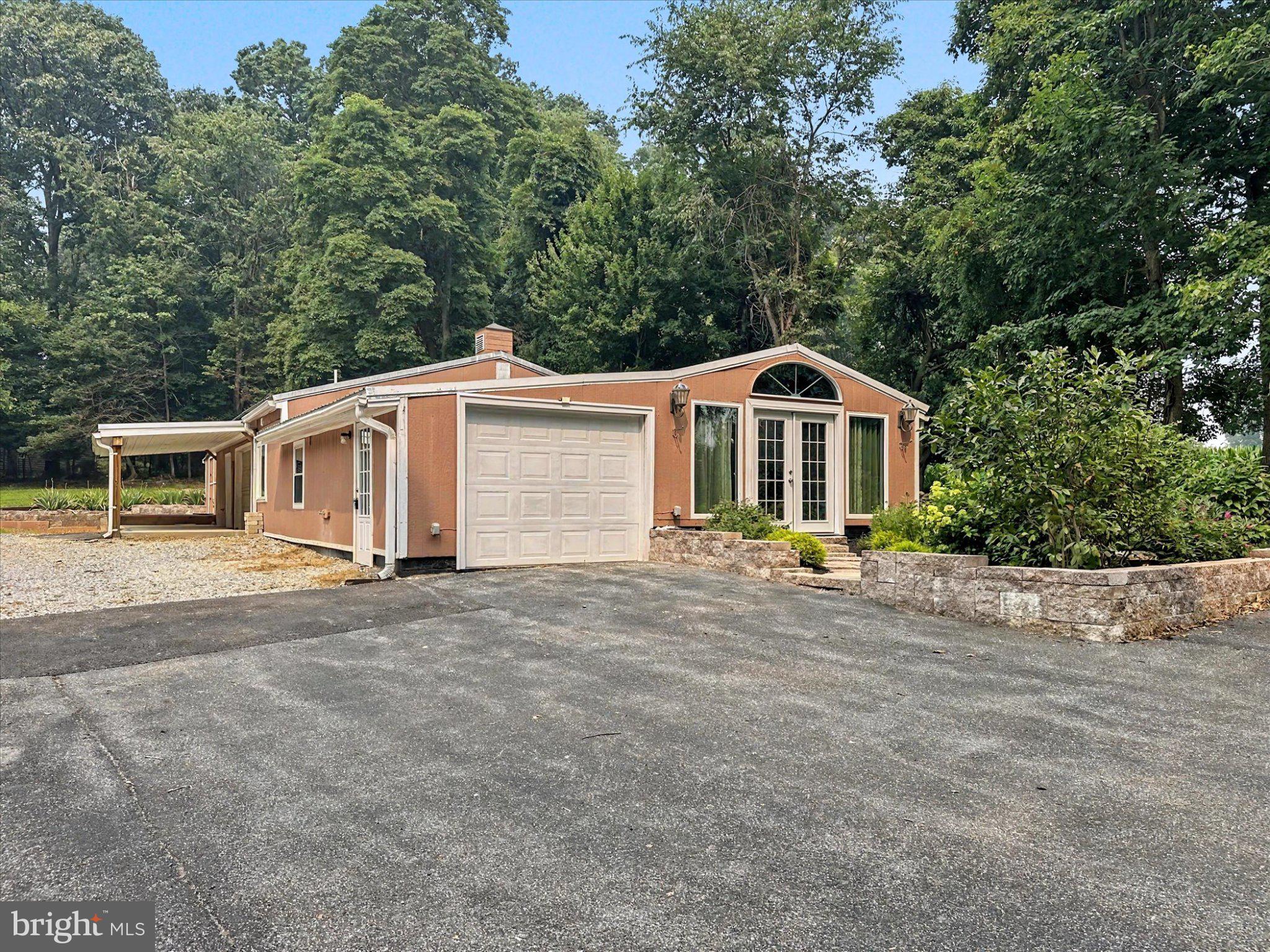 19717 5 Forks Road New Freedom, PA 17349 - Photo 3 of 35 Charming home nestled in lush greenery.