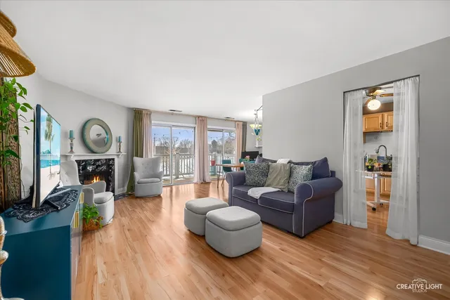 a living room with fireplace furniture and a flat screen tv
