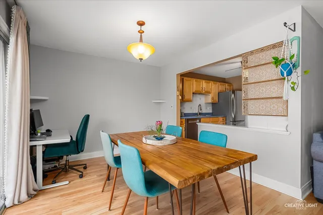 a view of a dining room with furniture and a window