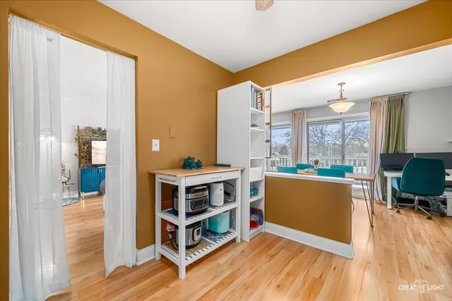 a view of living room with furniture and wooden floor