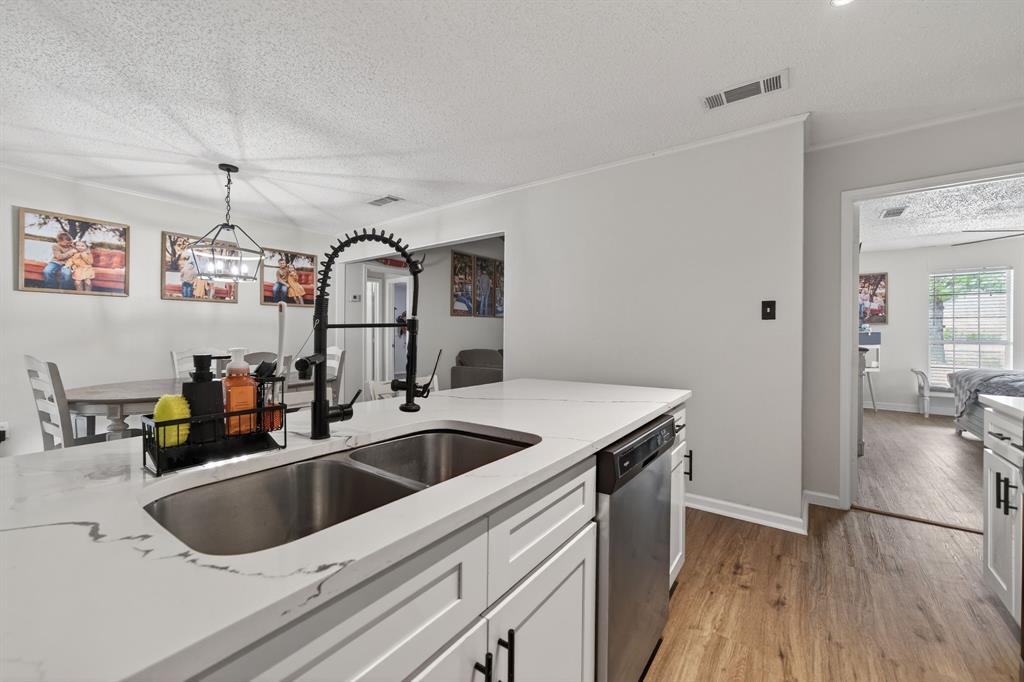 11474 Farm To Market 3094 Scurry, TX 75158 - Photo 13 of 40 a kitchen with a sink and a refrigerator