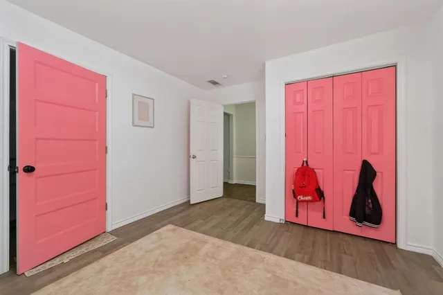 an entryway door with a bench in it