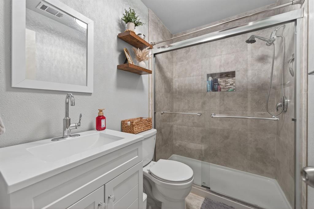 11474 Farm To Market 3094 Scurry, TX 75158 - Photo 21 of 40 a bathroom with a sink toilet and shower