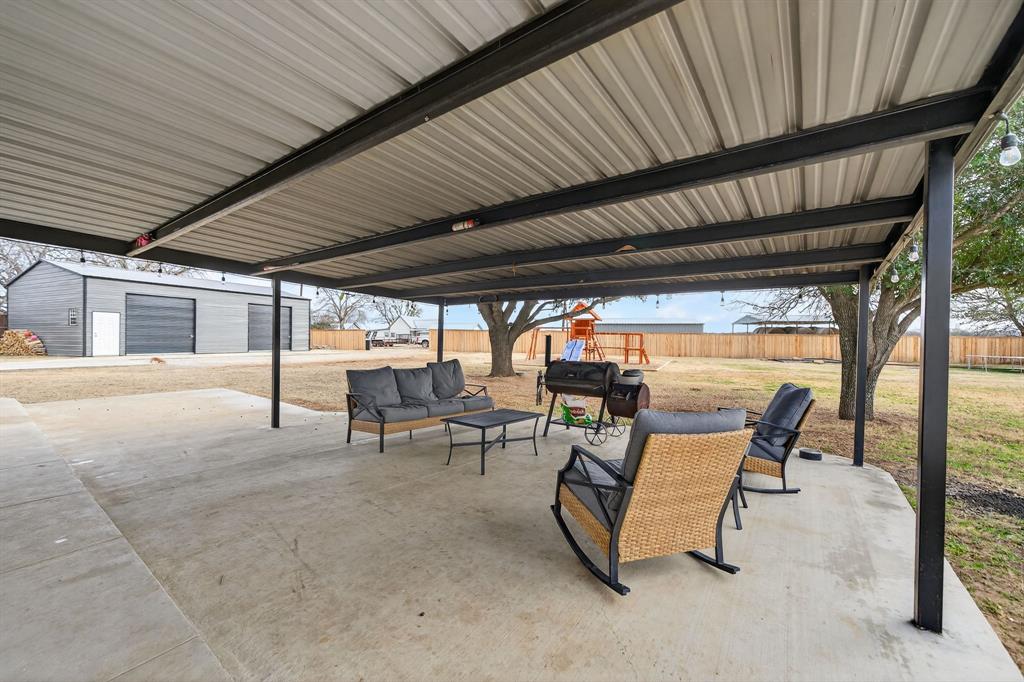 11474 Farm To Market 3094 Scurry, TX 75158 - Photo 28 of 40 a building outdoor space with patio furniture and potted plants