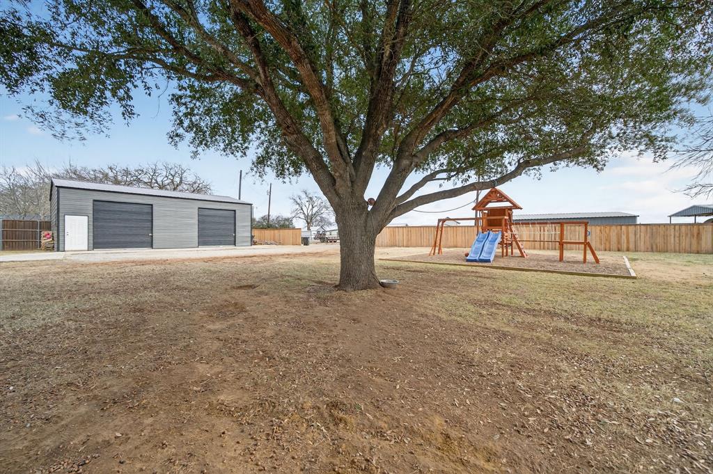 11474 Farm To Market 3094 Scurry, TX 75158 - Photo 29 of 40 a view of outdoor space with deck and large trees