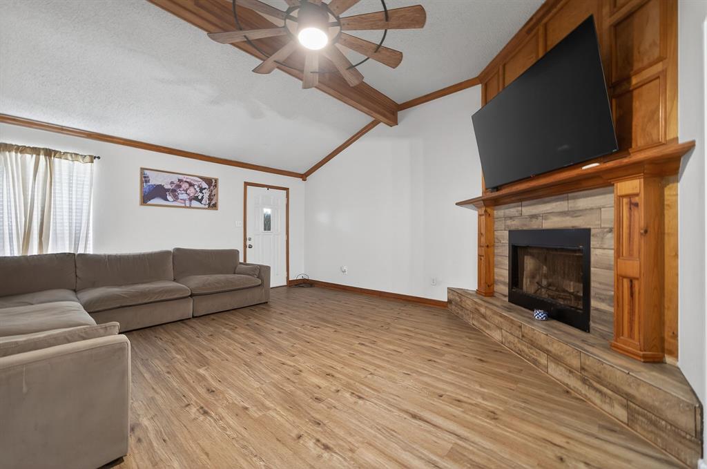 11474 Farm To Market 3094 Scurry, TX 75158 - Photo 6 of 40 a living room with furniture and a fireplace