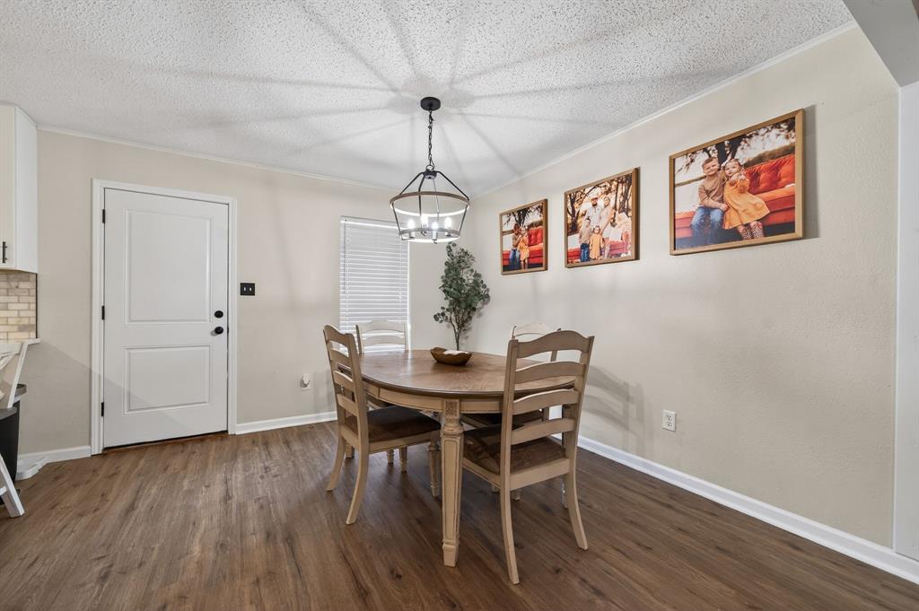 11474 Farm To Market 3094 Scurry, TX 75158 - Photo 8 of 40 a view of a dining room with furniture wooden floor and chandelier