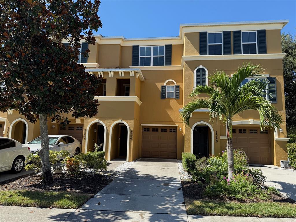 a front view of a house with a yard
