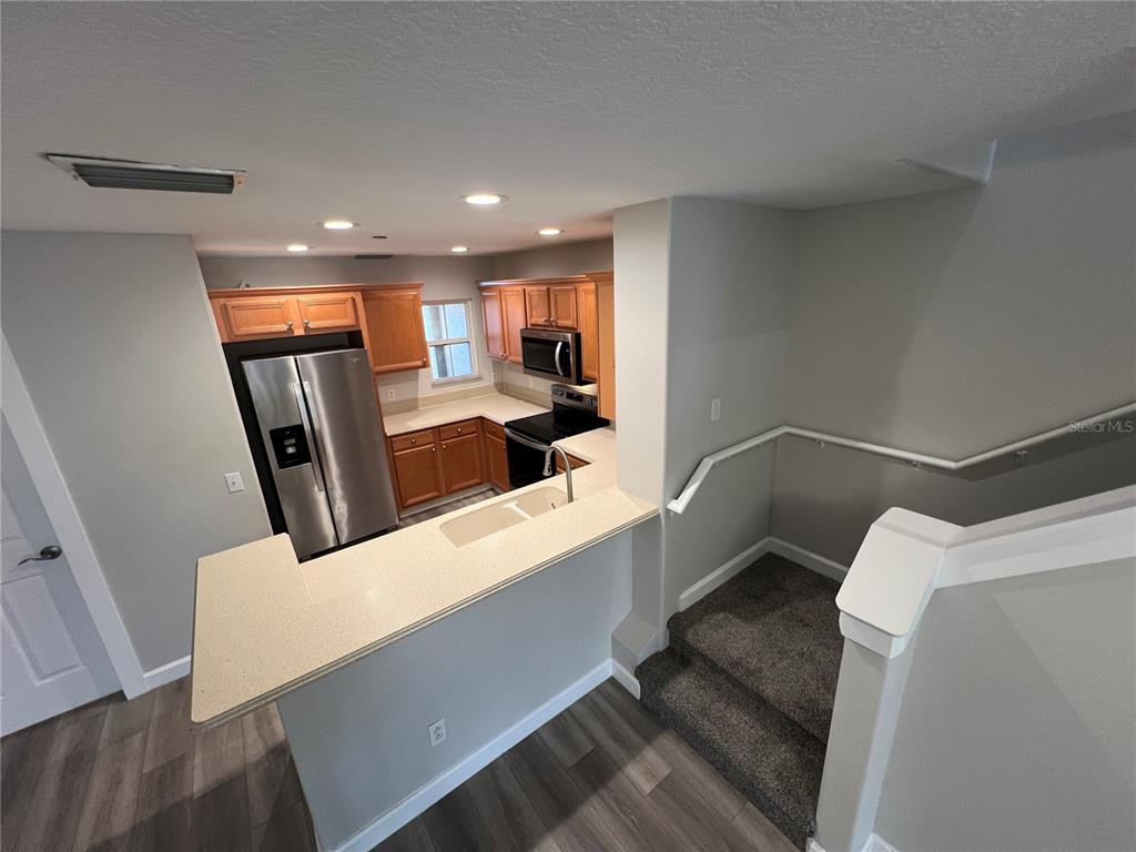 7350 Black Walnut Way Lakewood Ranch, FL 34202 - Photo 11 of 52 a view of a kitchen with large window