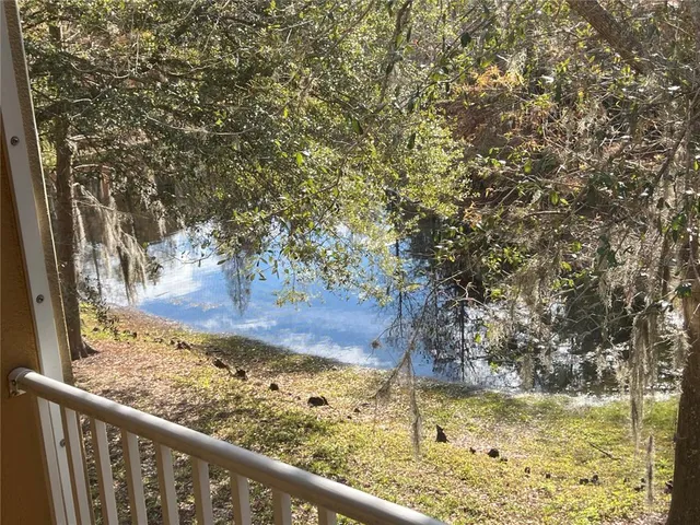 a bathroom with a granite countertop toilet and a shower