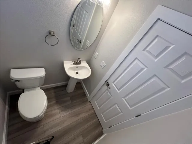 a view of a yard with large trees