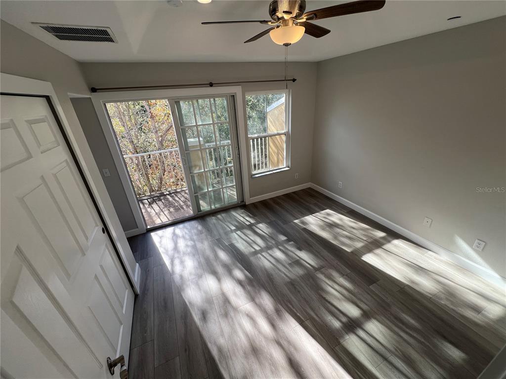7350 Black Walnut Way Lakewood Ranch, FL 34202 - Photo 24 of 52 a view of an empty room and wooden floor