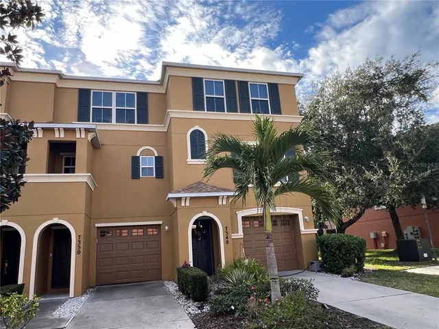 a kitchen with stainless steel appliances a refrigerator stove and microwave