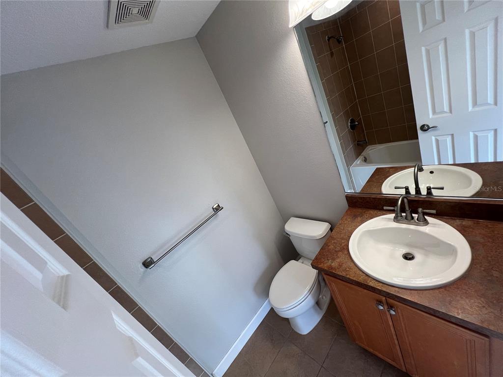 7350 Black Walnut Way Lakewood Ranch, FL 34202 - Photo 31 of 52 a bathroom with a sink and a mirror