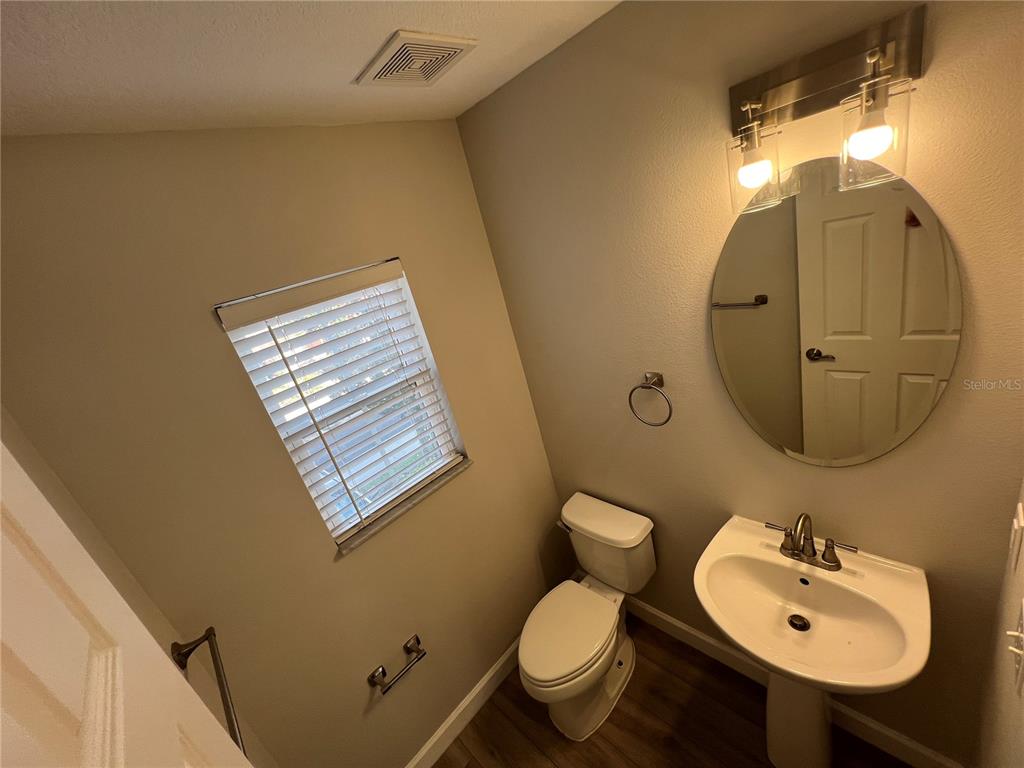 7350 Black Walnut Way Lakewood Ranch, FL 34202 - Photo 39 of 52 a bathroom with a toilet sink and mirror