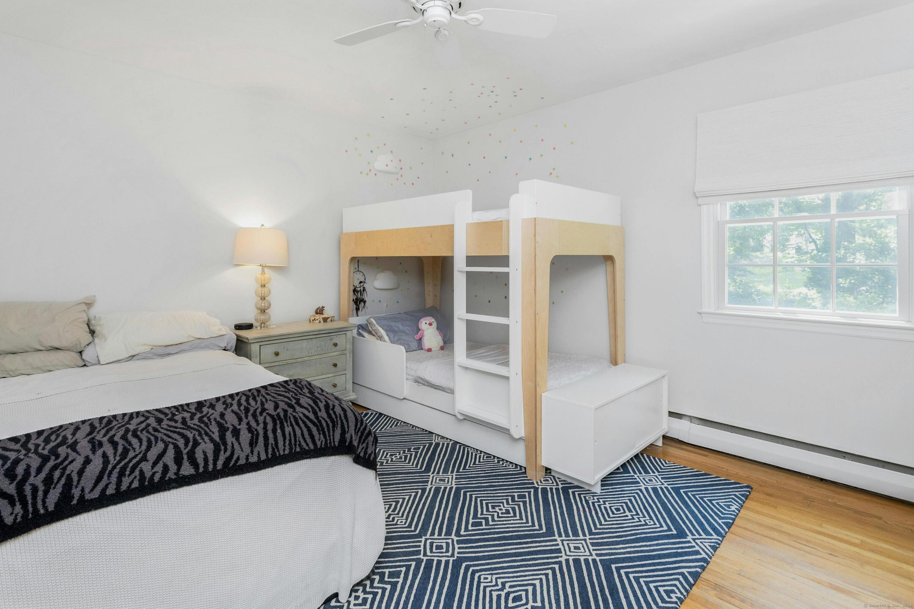 21 Roxbury Lane Wilton, CT 06897 - Photo 24 of 37 The first secondary bedroom. Many windows on the second floor are new.